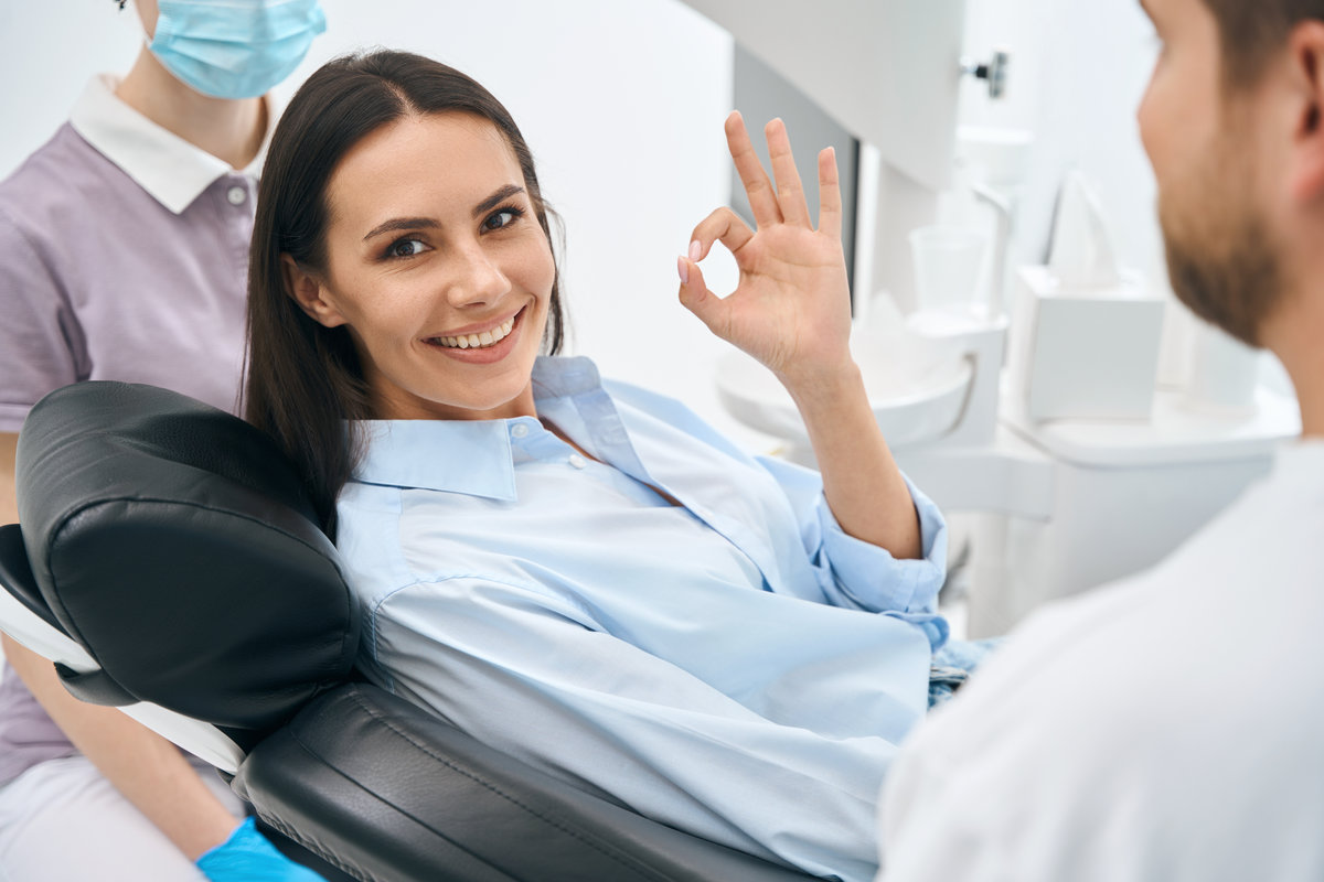 Happy dental patient giving a thumbs up in the chair, serving DeLand, FL